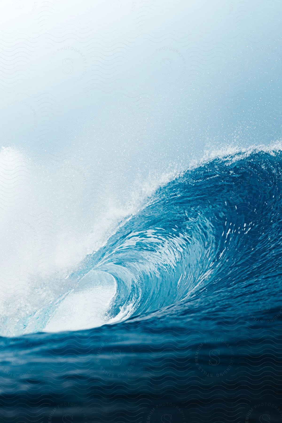 A wave curling into a pipe in the ocean