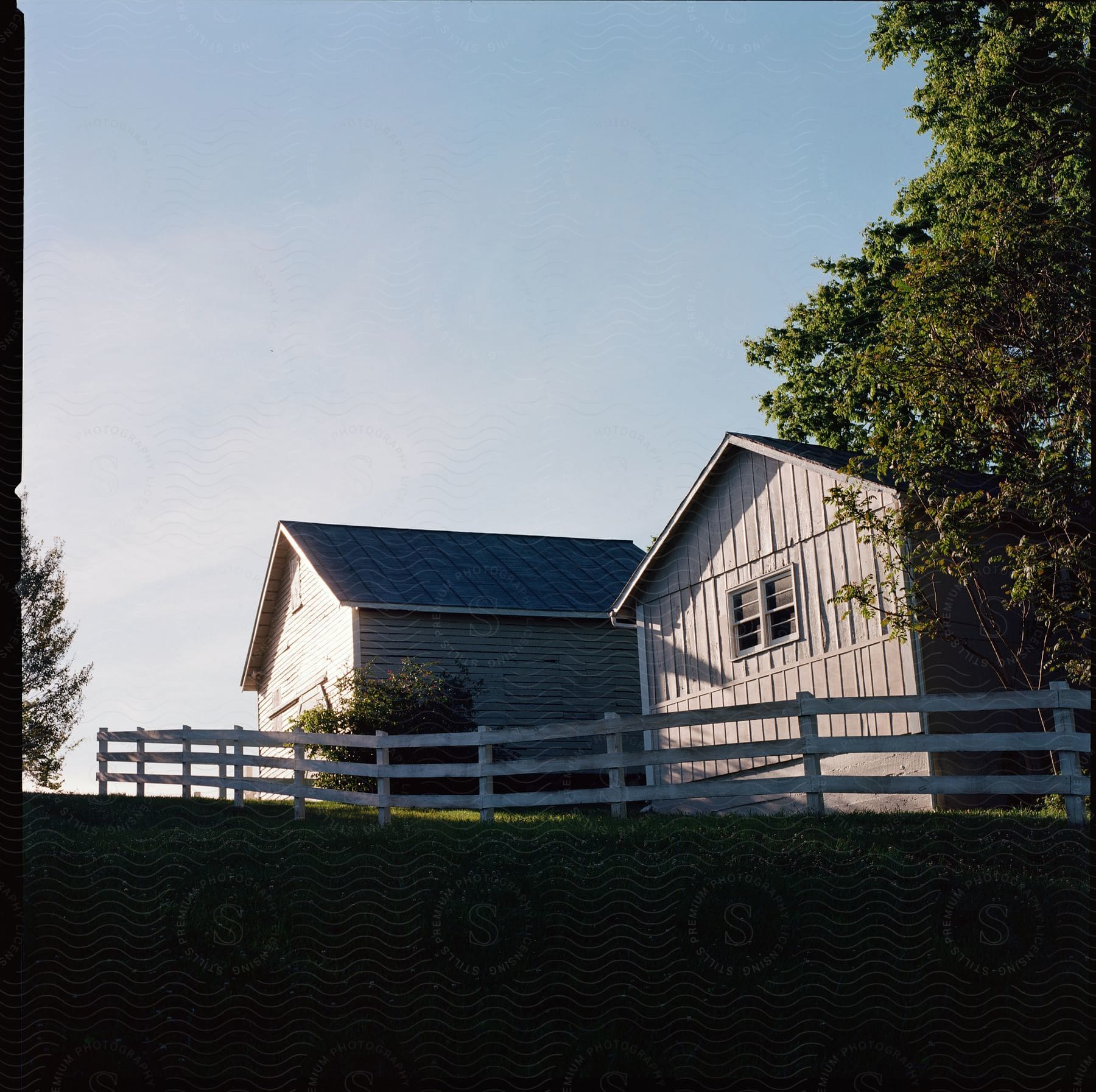 A farmhouse with a flat field on a sunny morning in virginia