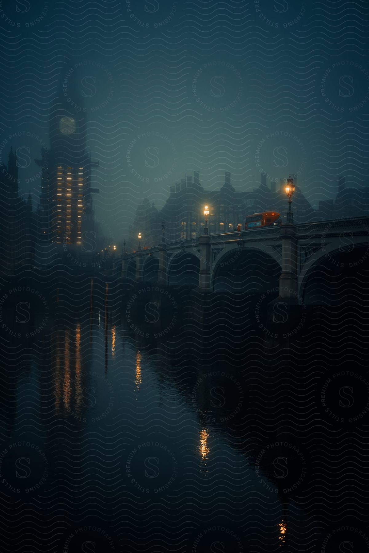 Big ben next to the thames river and the westminster bridge in london