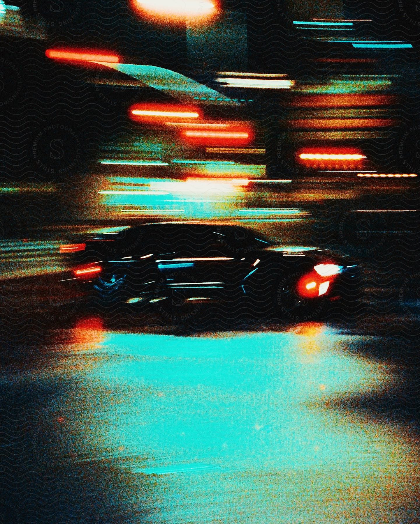 A Car Races Through The City Blurred Lights All Around