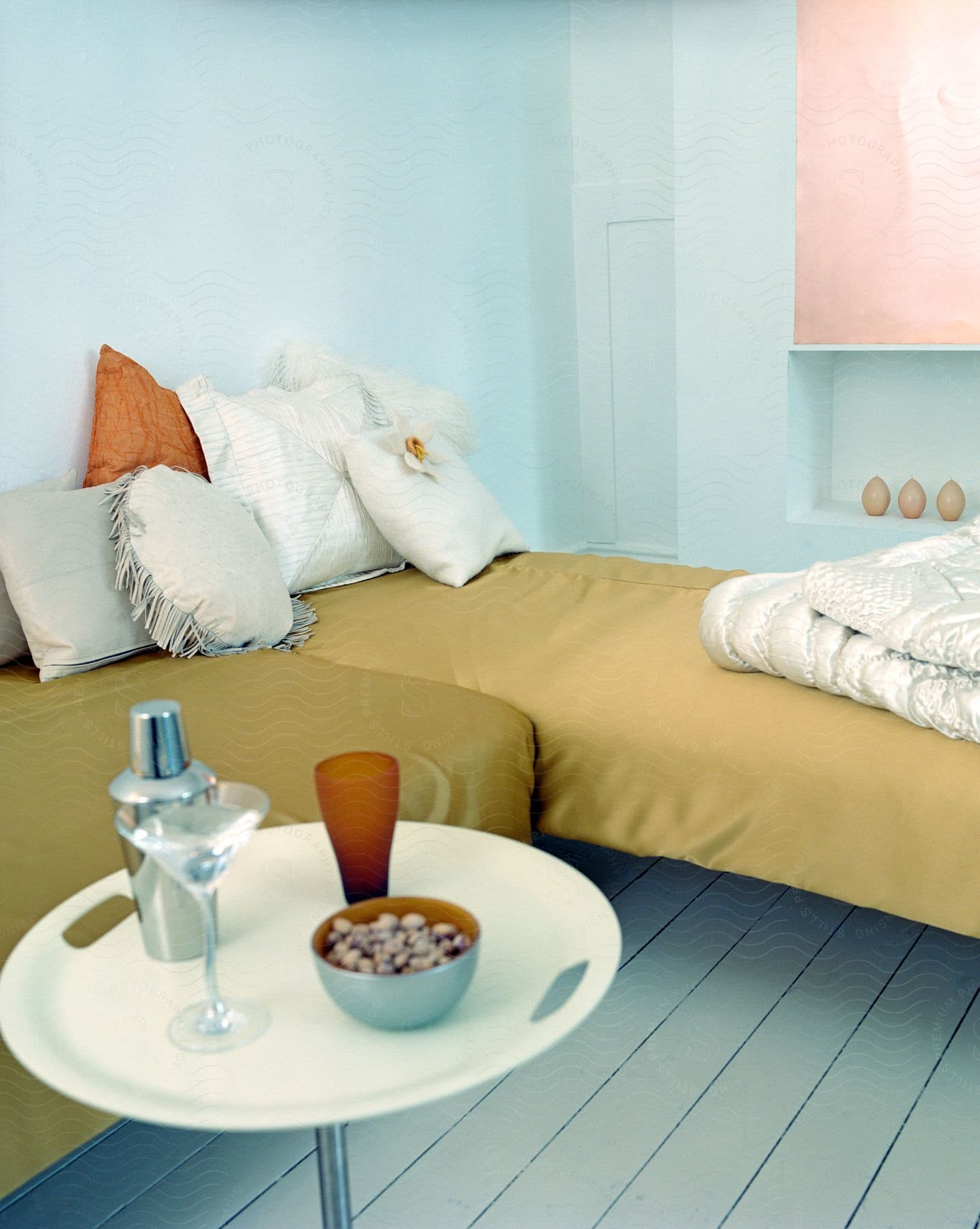 Bedroom with beds adorned with brown bed sheets pillows and blankets