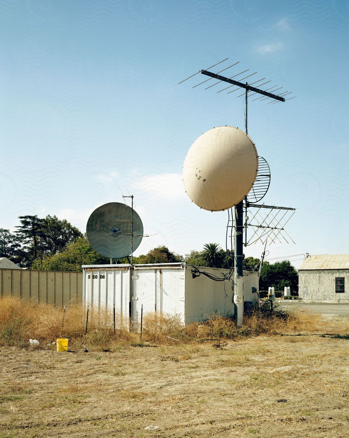 Agricultural scene with no people featuring outdoor surroundings and various objects such as electrical devices balloons and antennas the image also includes elements of the sky plants biome radar and telecommunications engineering