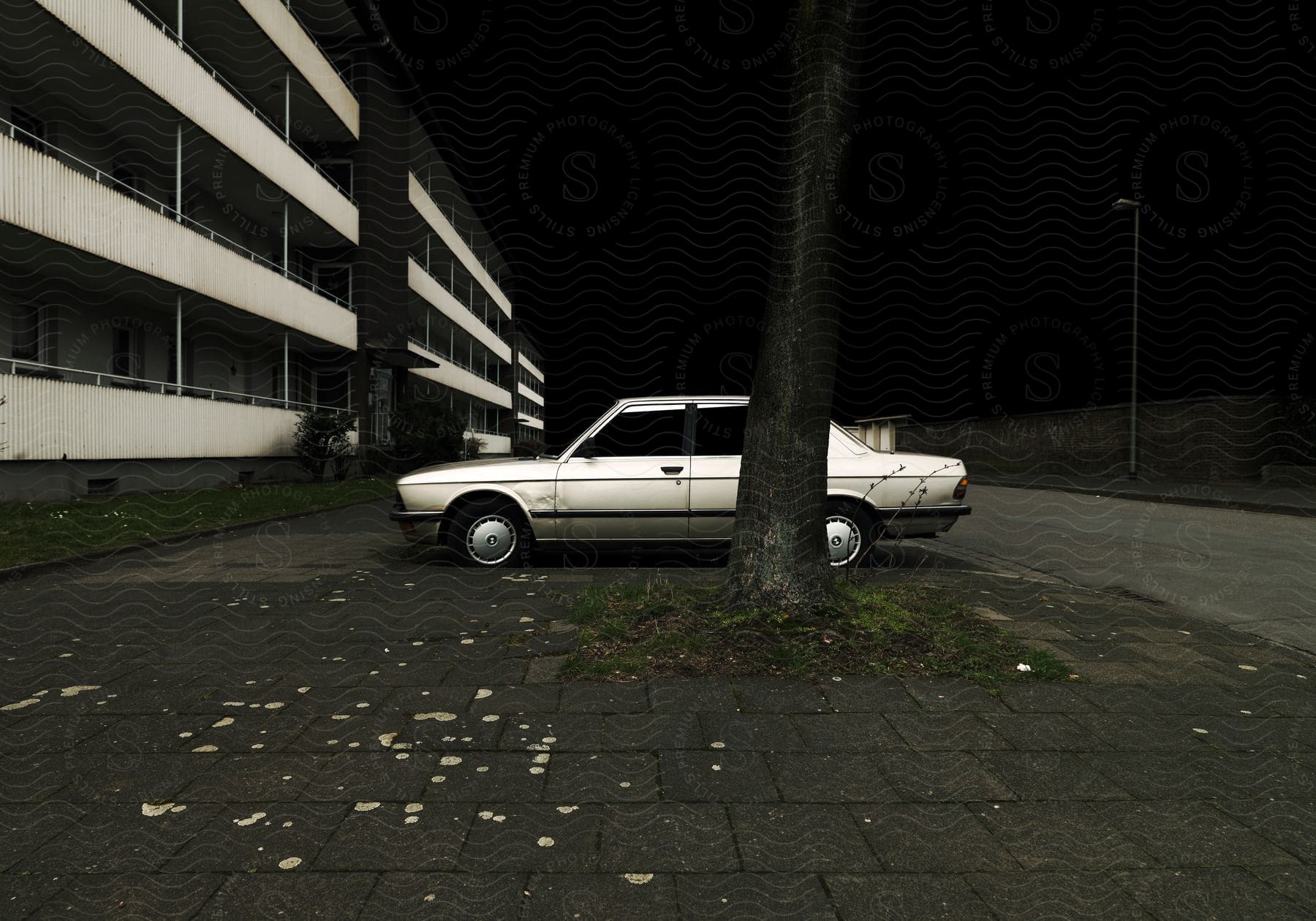 A car is parked outdoors in a city street