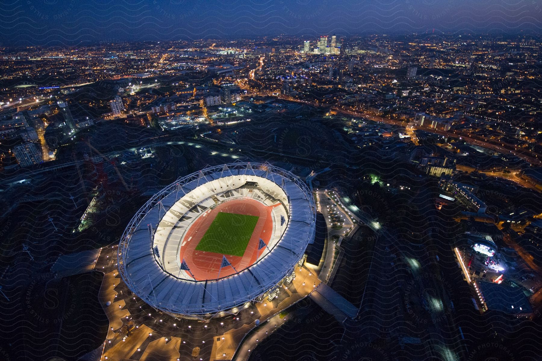 A brightly lit stadium at night radiating excitement in all directions