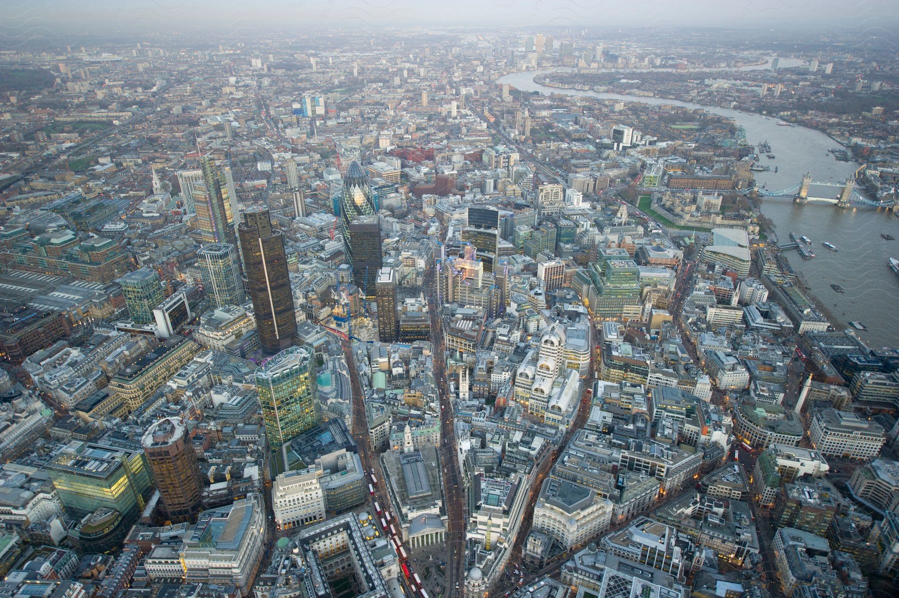 Aerial perspective of london skyline and tower bridge at dusk