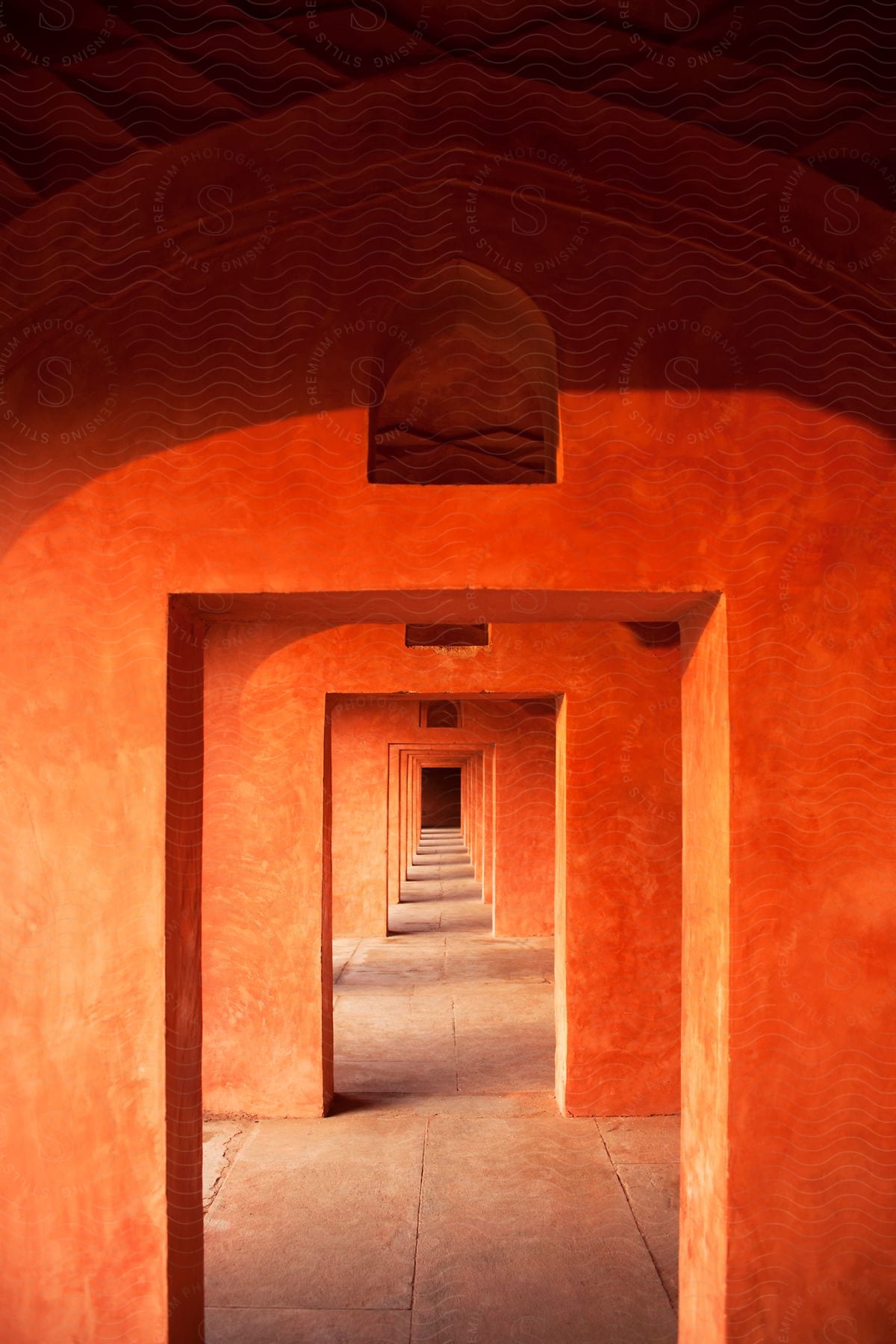 An exterior hallway with arches in a building