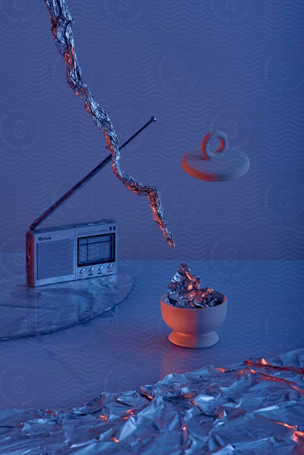 Stock photo of an open port and a radio in a room with a pot cover in the air