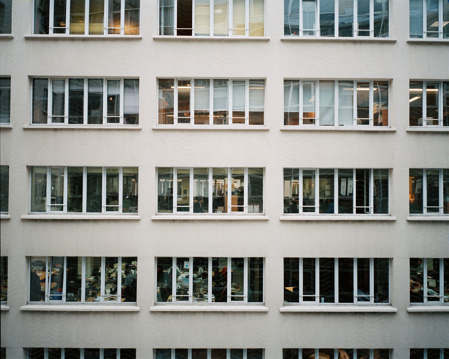 High rise building with white metal framed rectangular window sections