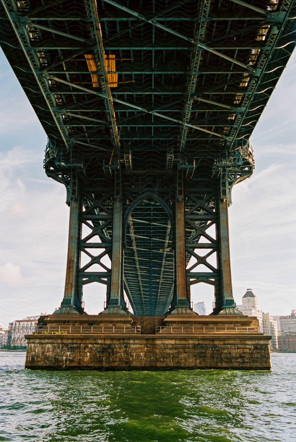 Underneath a bridges architectural design looking up