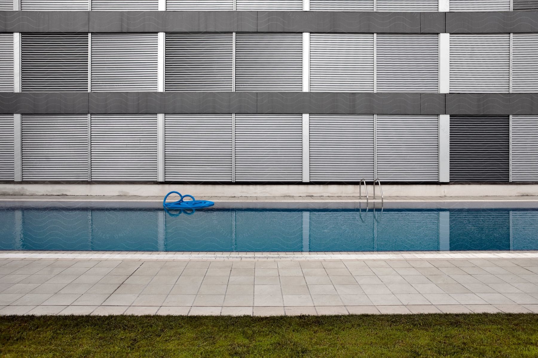 An iron fence with a pool