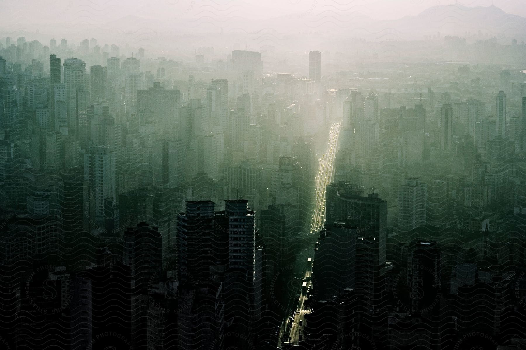 A cityscape with buildings and cloudy sky