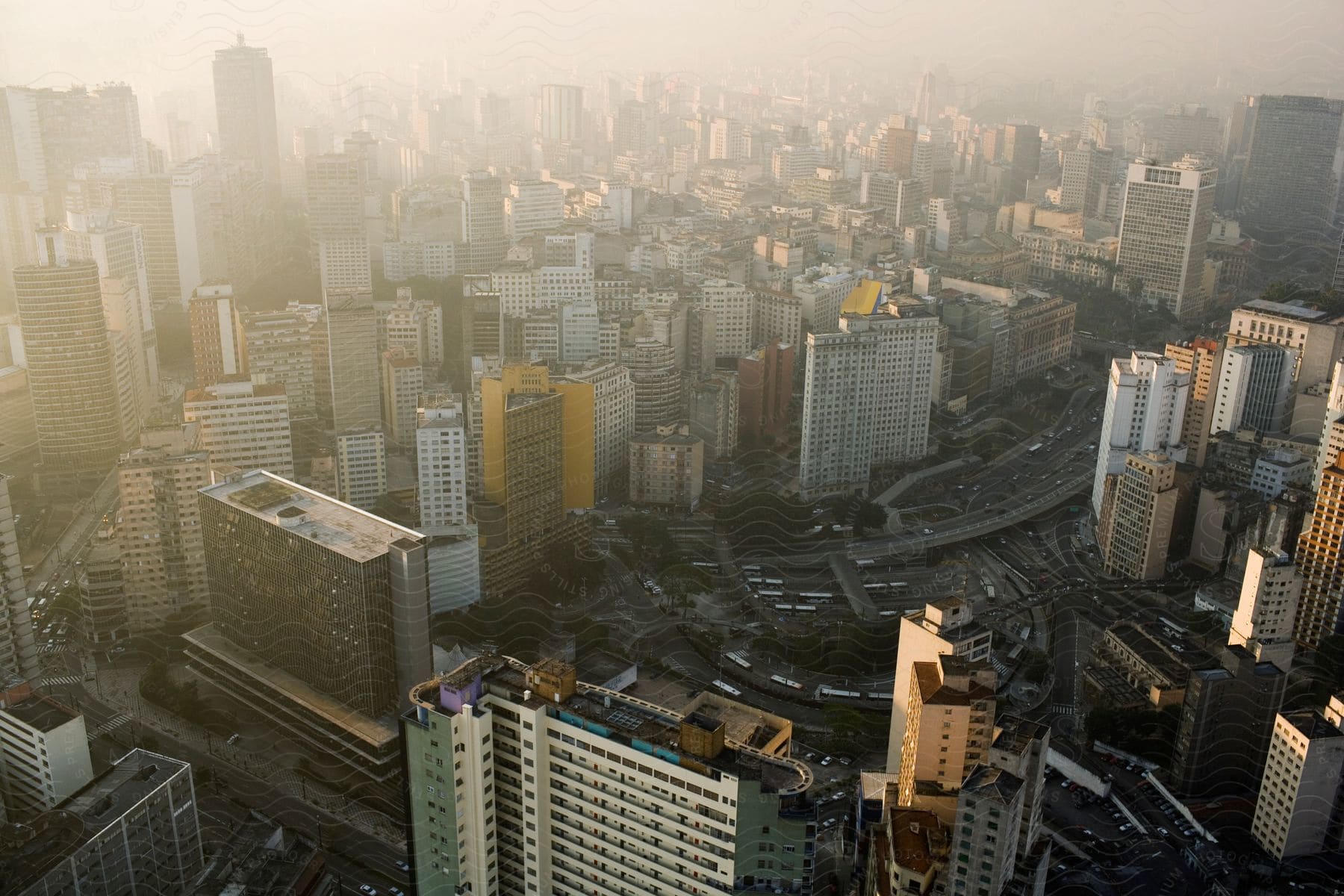 Aerial view of a bustling city with a highway seen from above