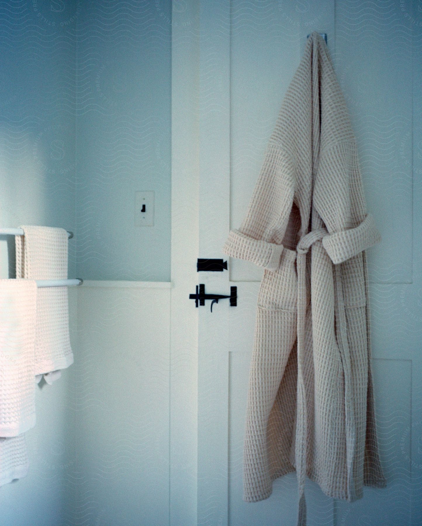 Bathrobe hanging on a bathroom door