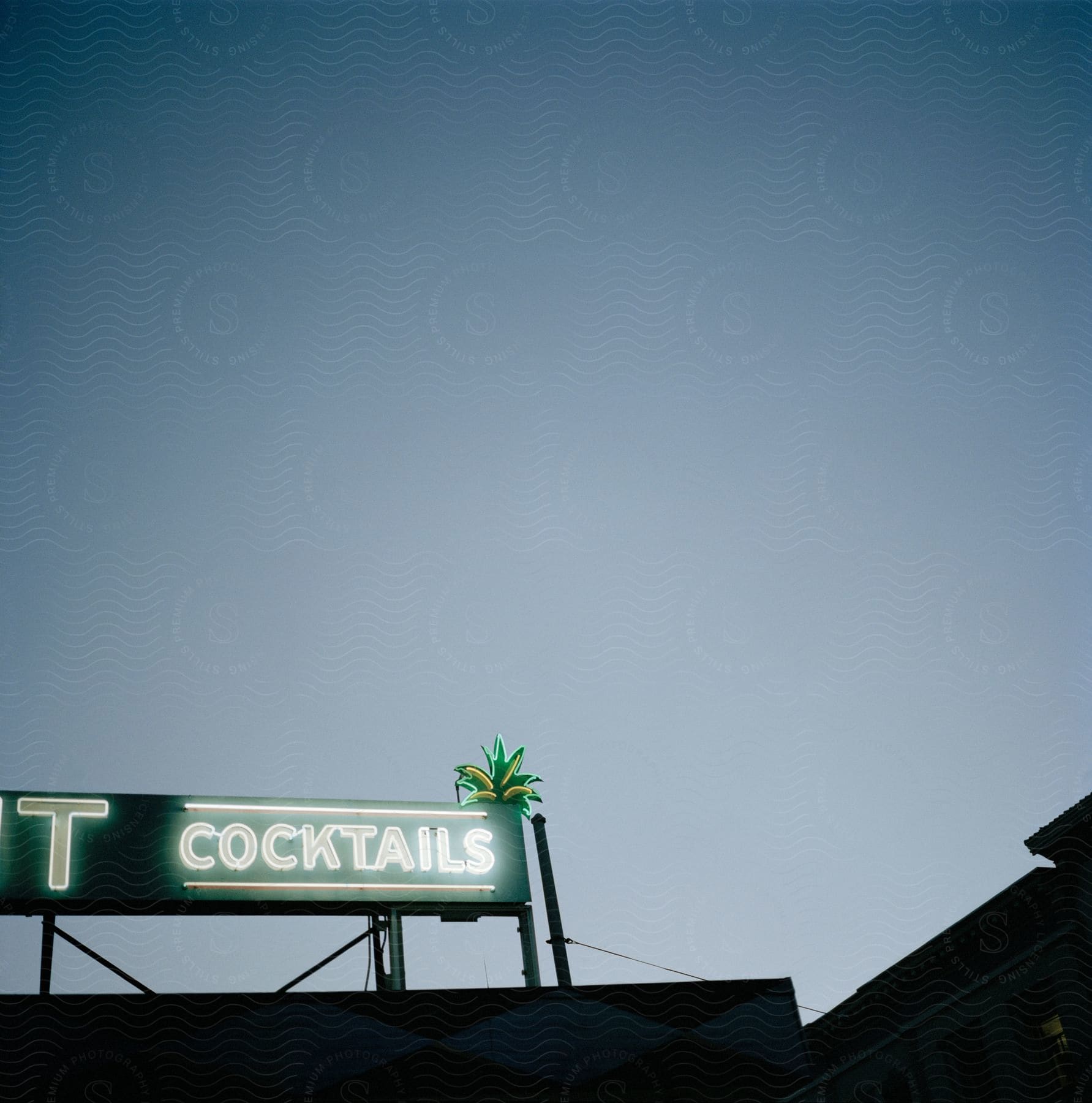 Neon sign on bar roof advertises cocktails in san francisco california