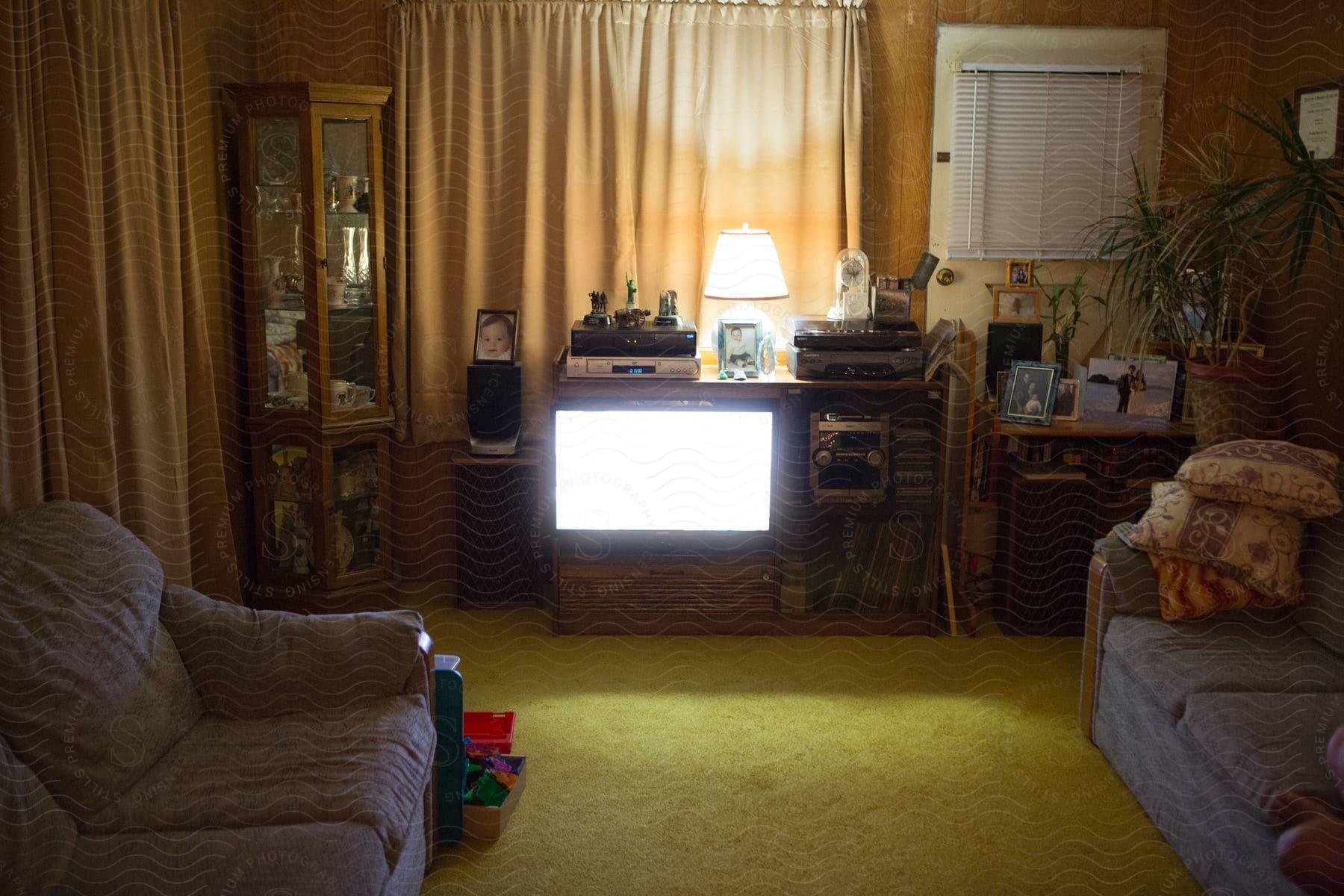 An old tv and other vintage electronics are seen in a living room