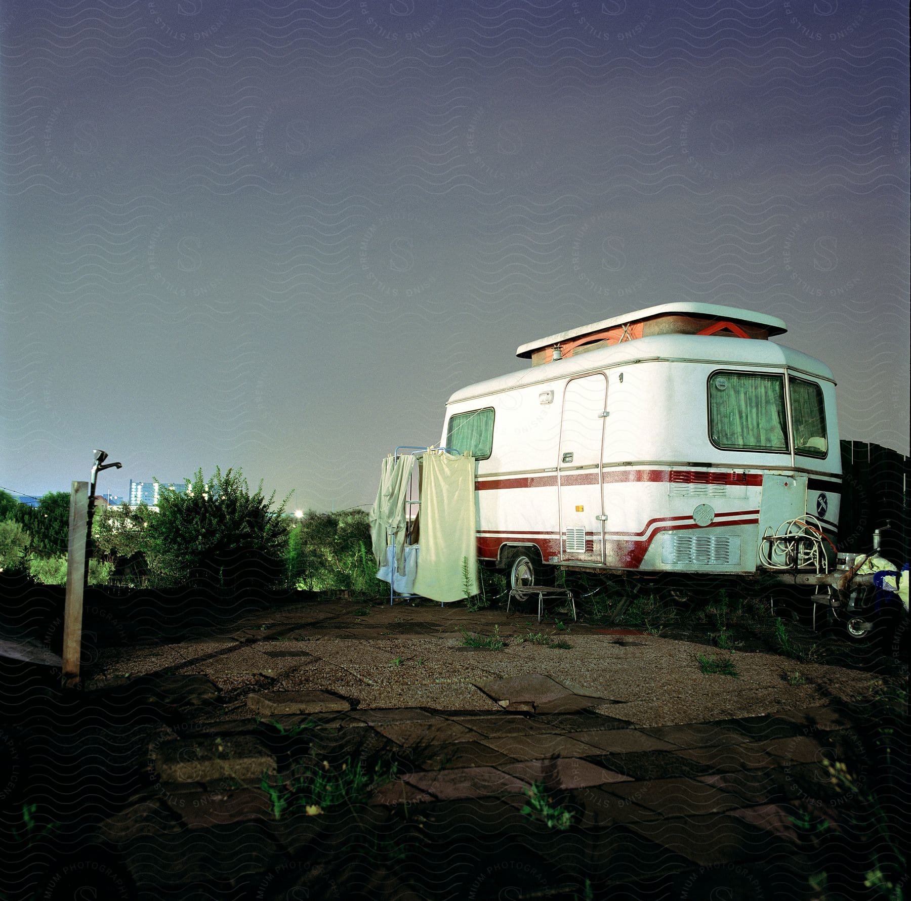 An rv is parked next to a water hydrant