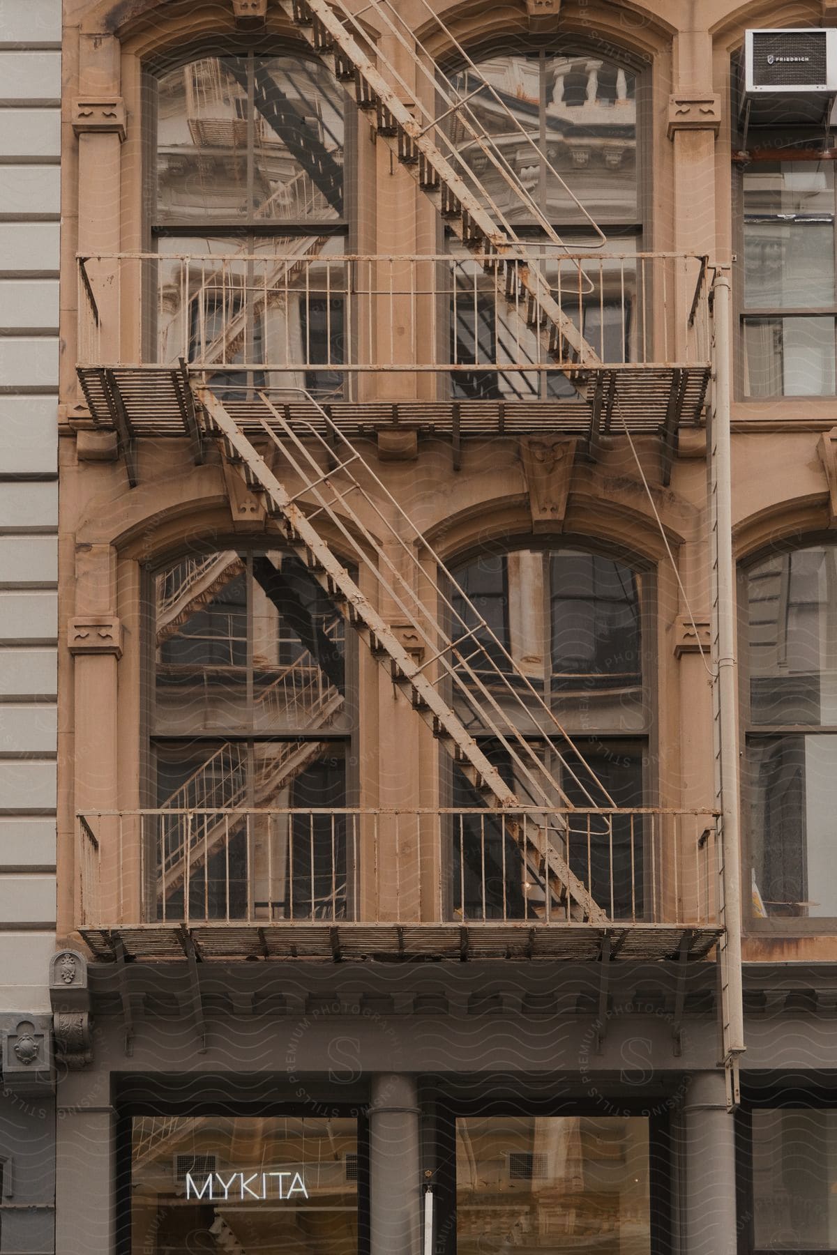 A fire escape is shown above a building called mykita