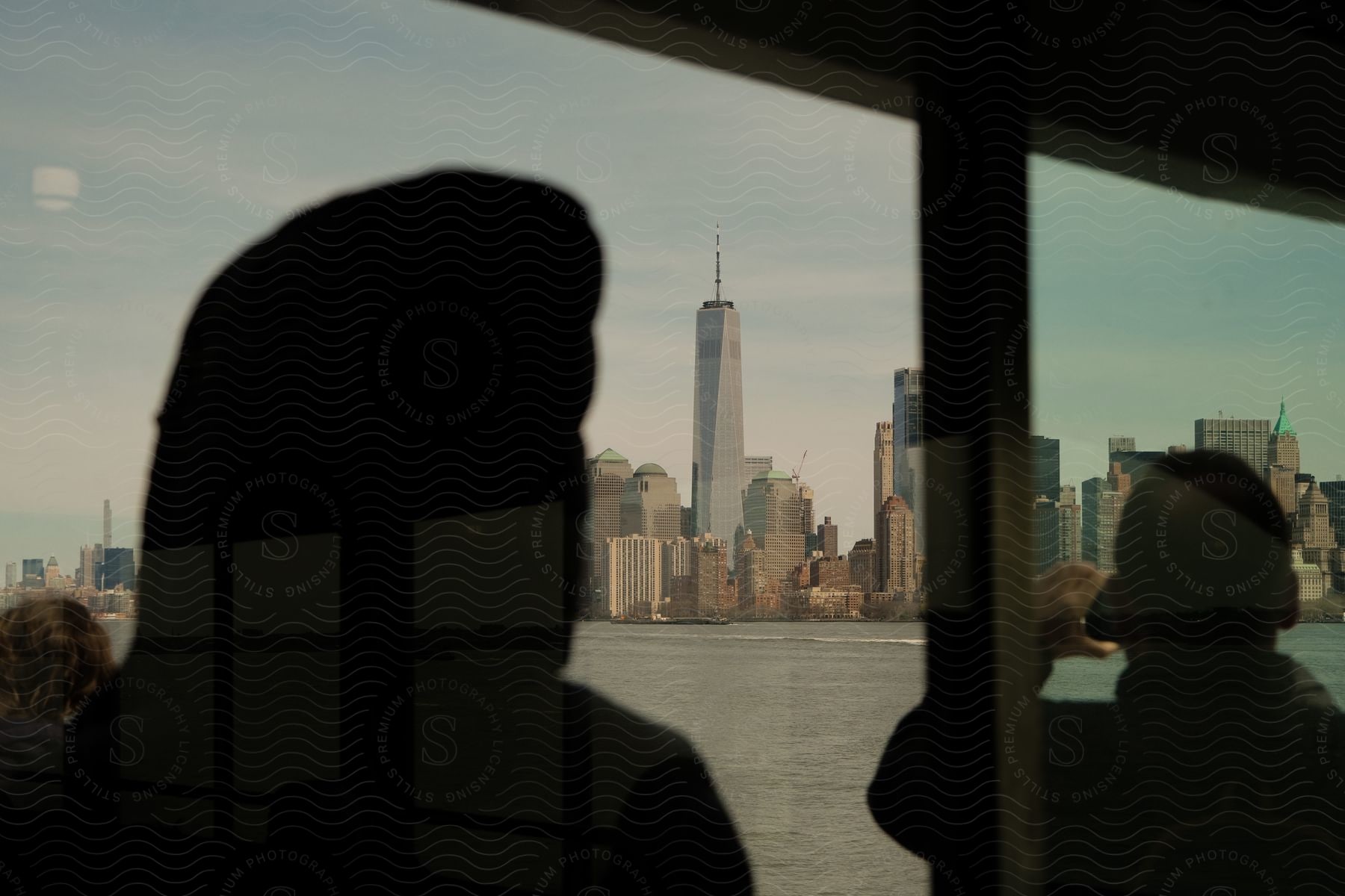 Downtown manhattan with freedom tower seen from a boat in the bay