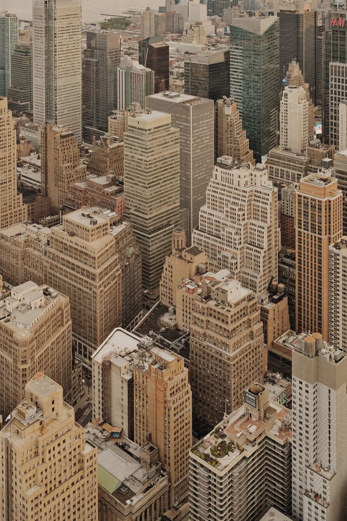 Aerial view of tall city buildings with small windows and creamcolored facades