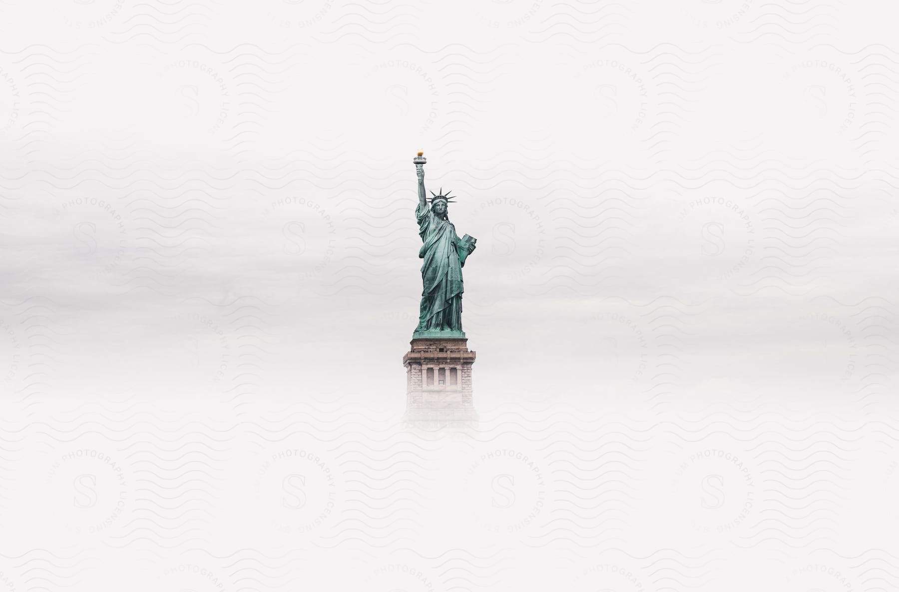 Digital artwork of the statue of liberty surrounded by mist in new york city