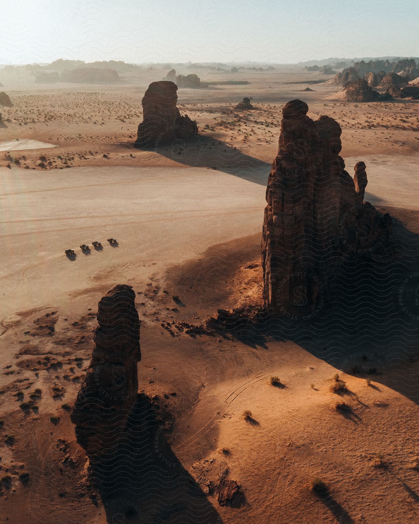 Rock formations and buttes dot the desert badlands in saudi arabia