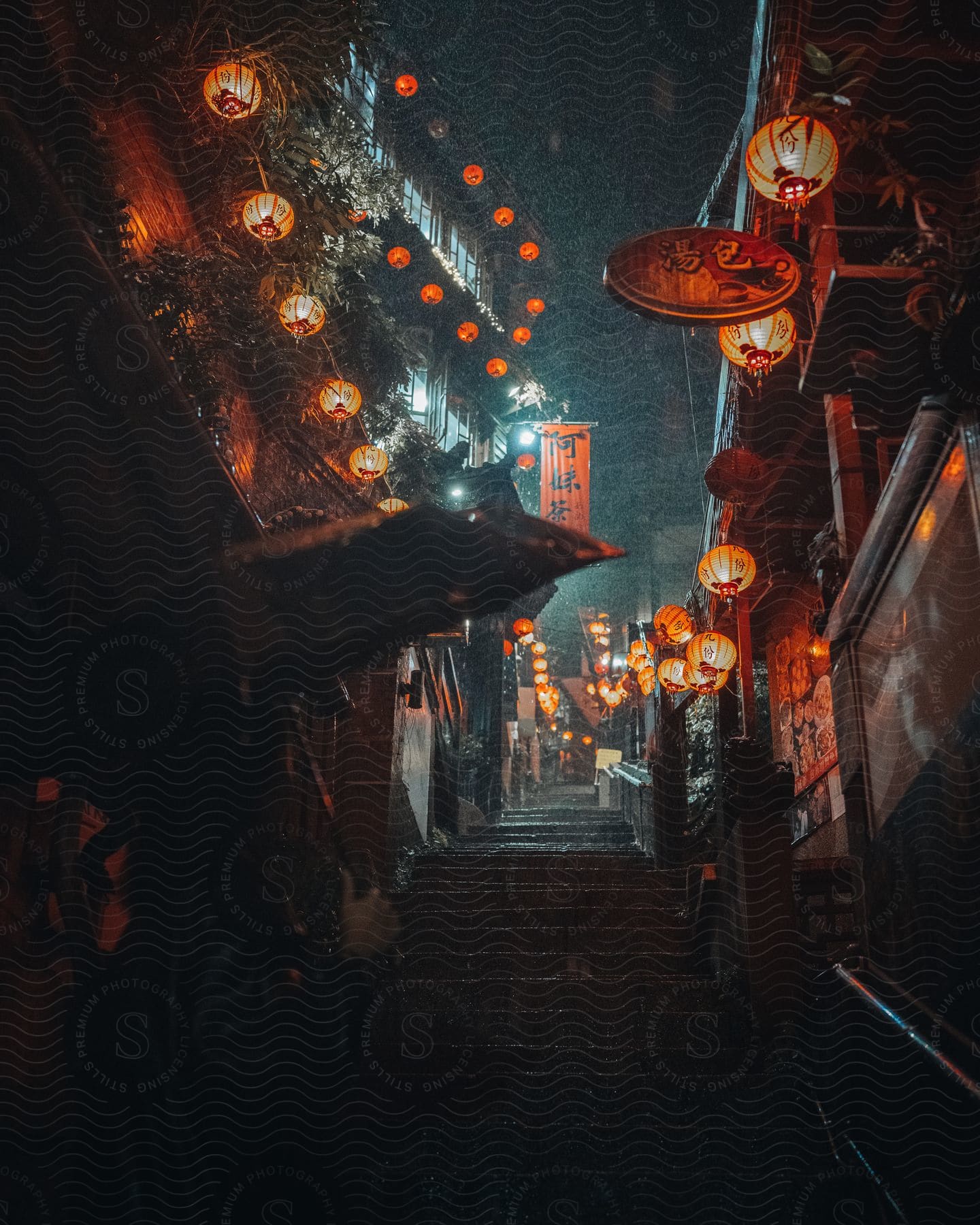 An asian street with lanterns at night