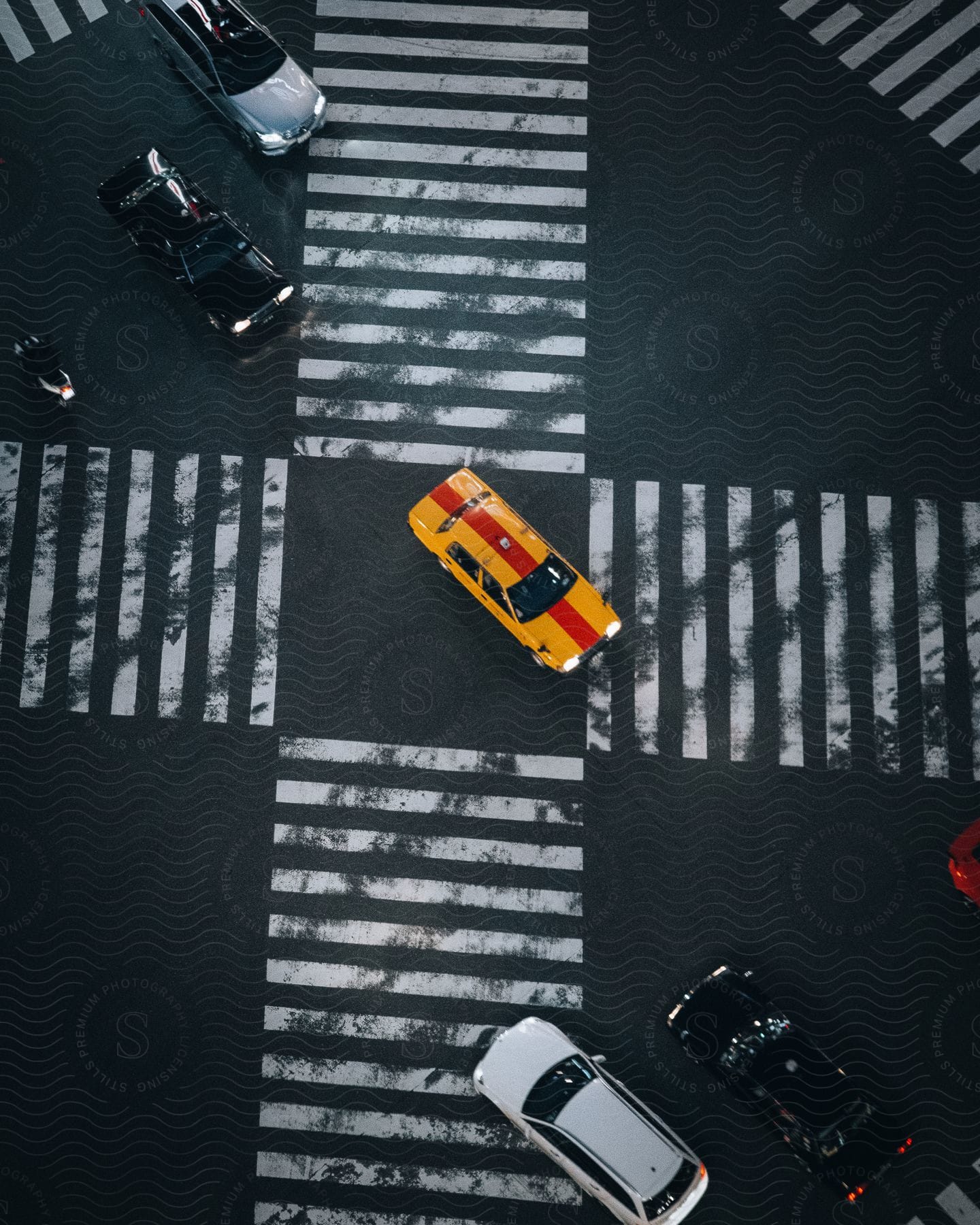 Aerial shot of cars driving on a street during the day