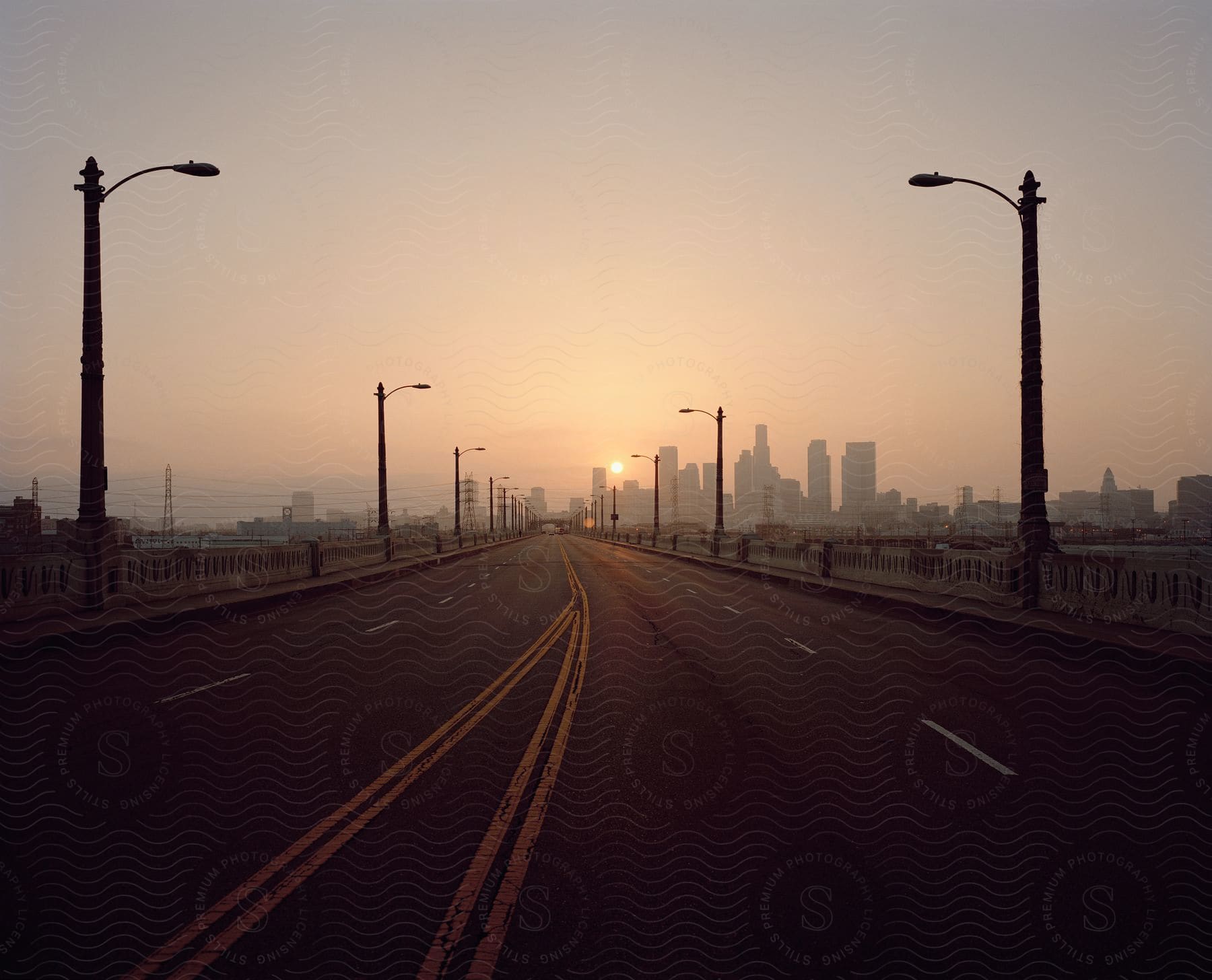 Downtown los angeles seen from a major street at dusk