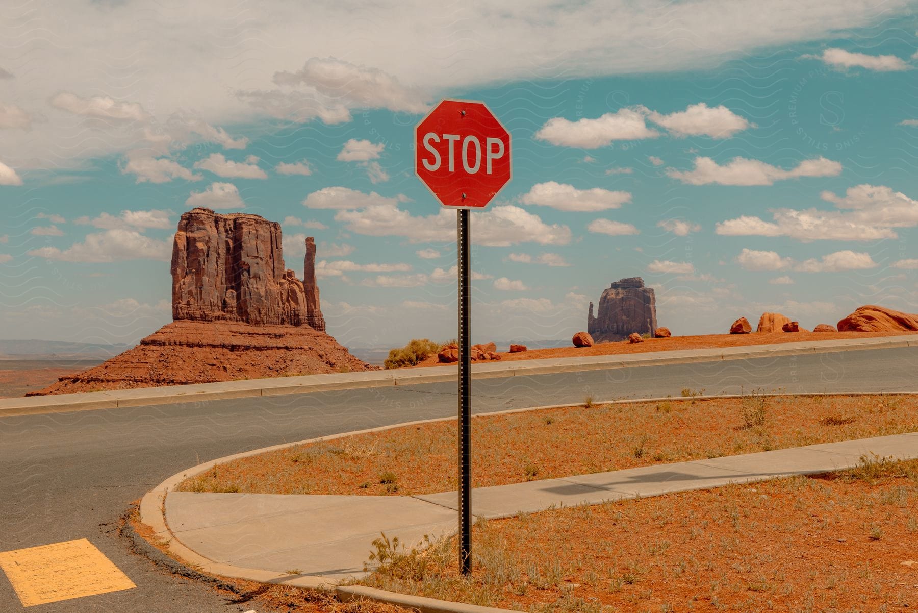 A neutral landscape with a stop sign in monument valley