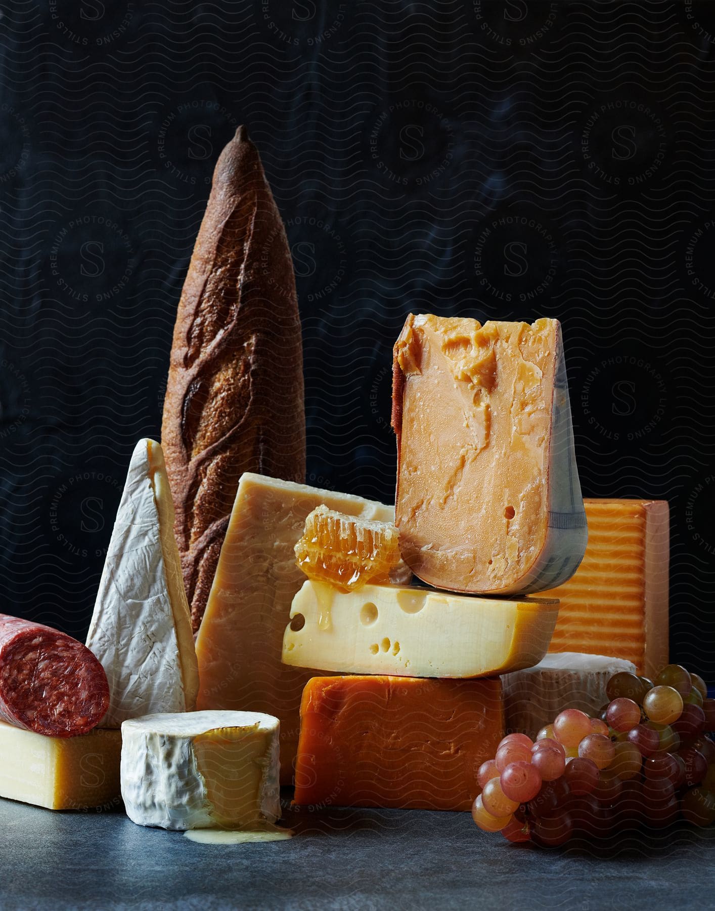 Grapes Bread And Various Types Of Cheese Arranged For Display