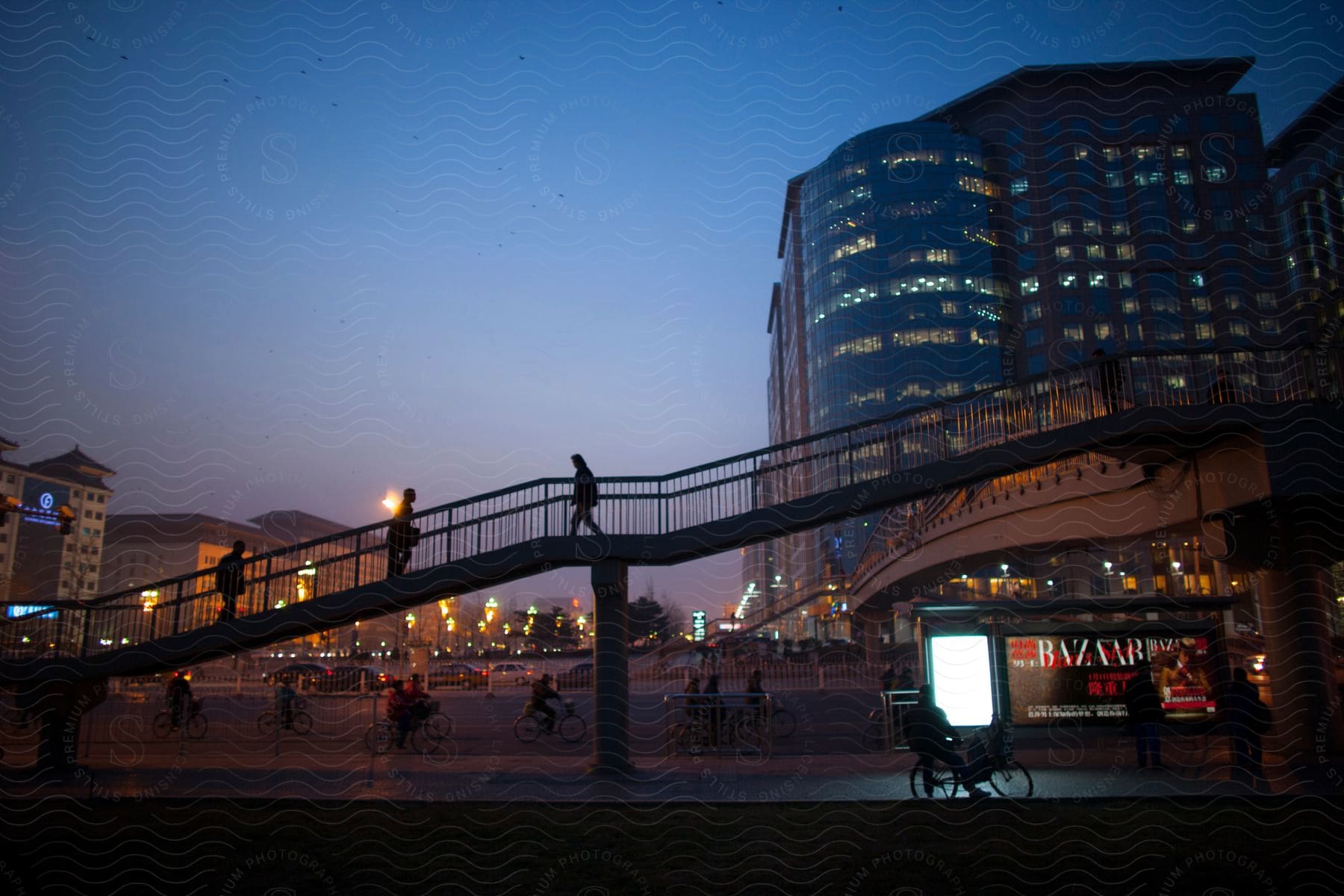 People riding bicycles in a city at night