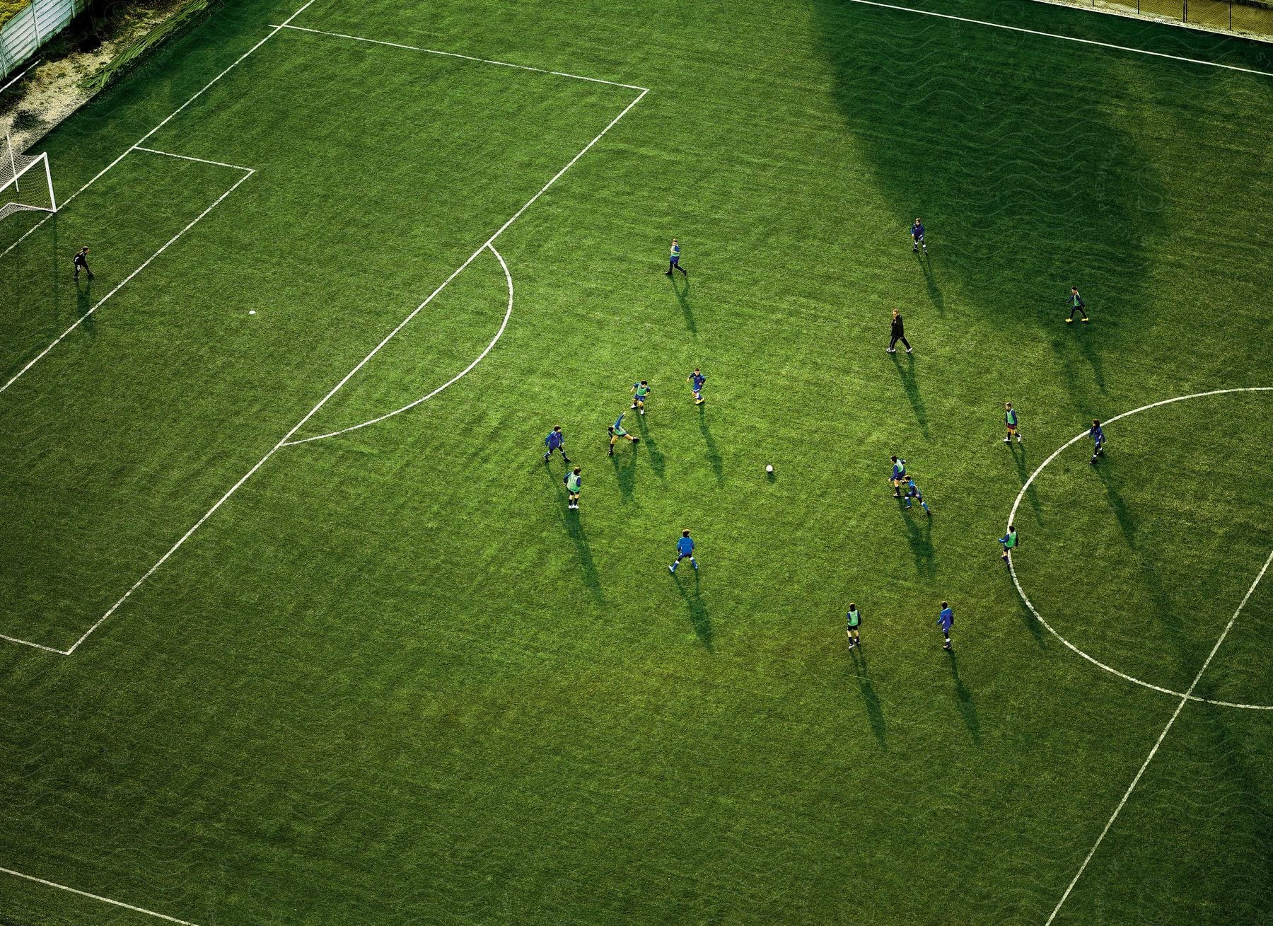 Aerial view of a soccer game being played on a soccer field outdoors