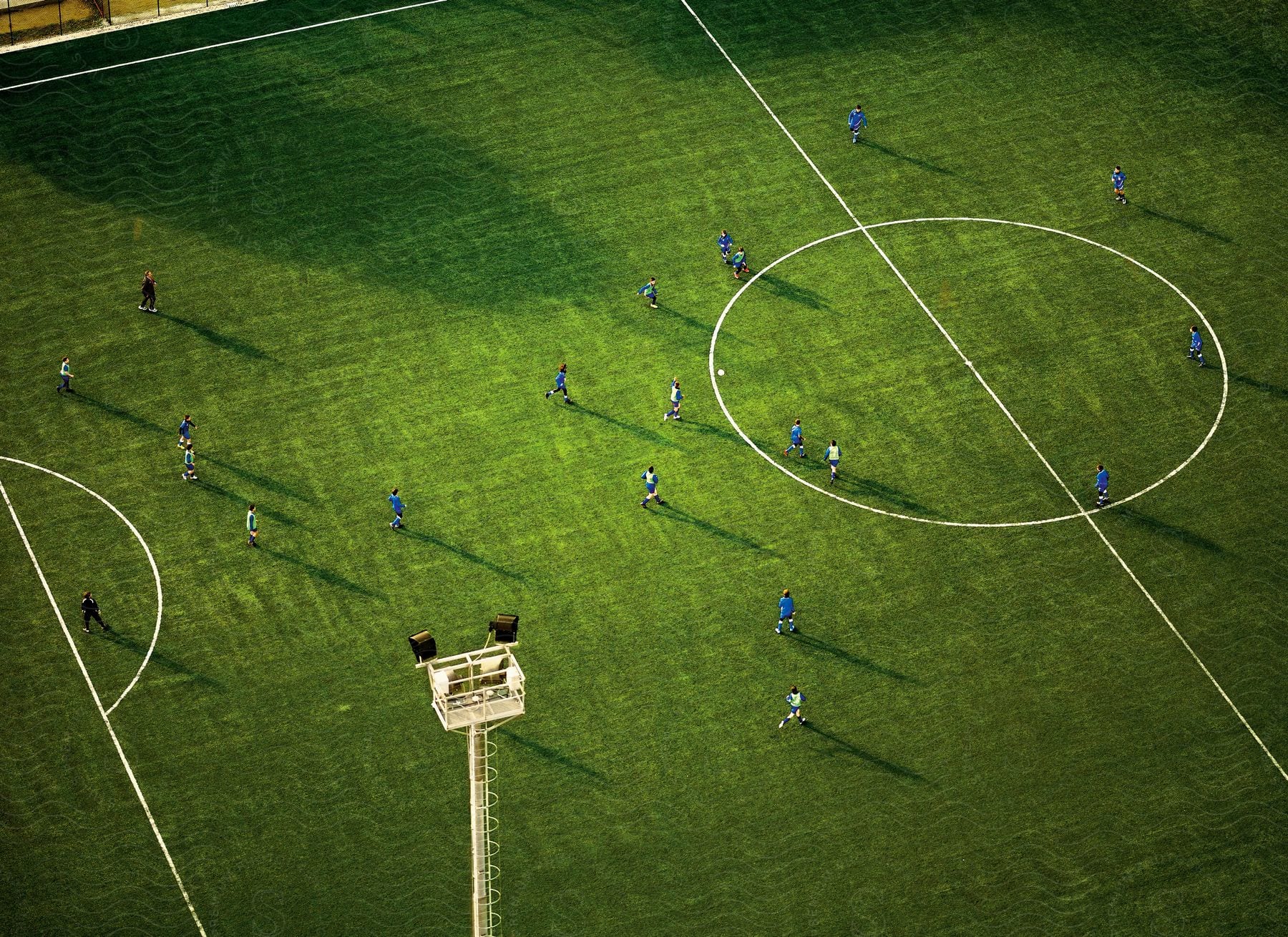 Aerial view of an inprogress soccer game in a professional stadium