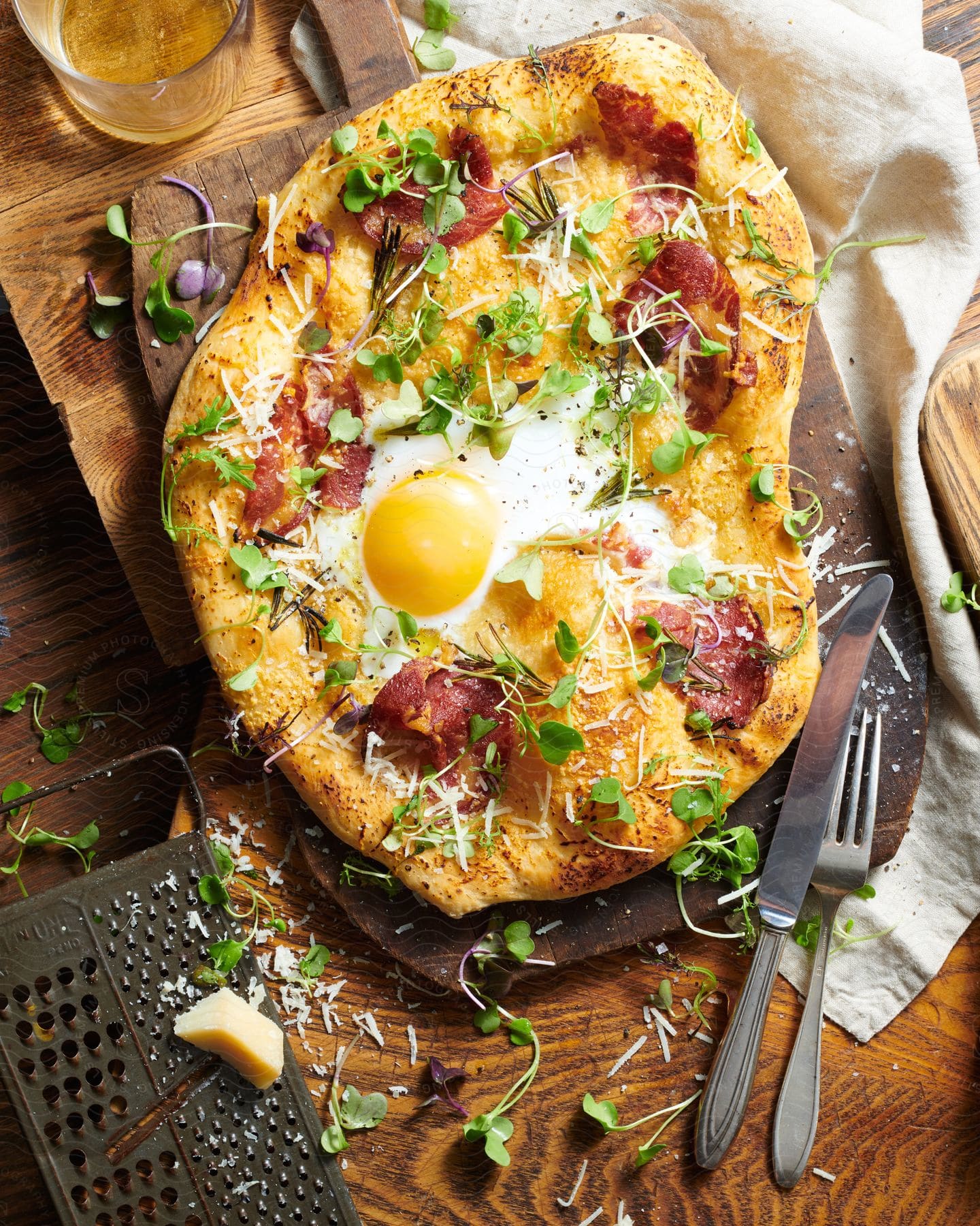 An omelet with vegetables ham cheese and a sunny side up egg