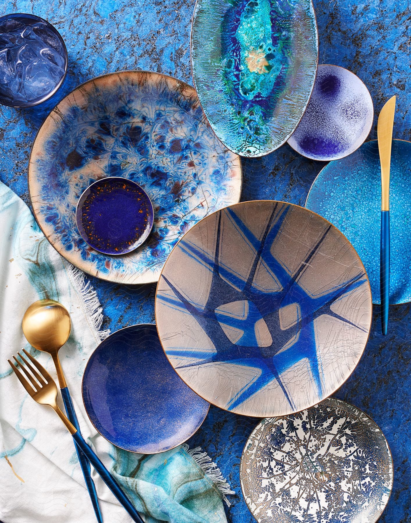 Blue plates and dishes on a table with cutlery