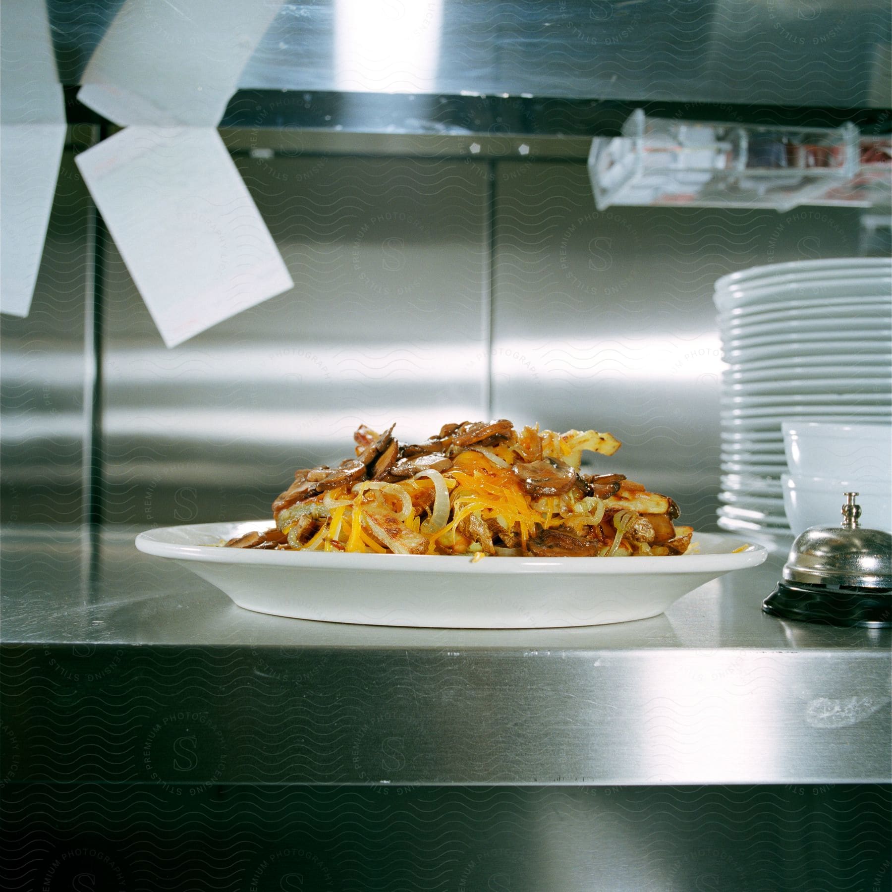 A prepared breakfast dish sits on a kitchen shelf ready to be picked up by waitstaff