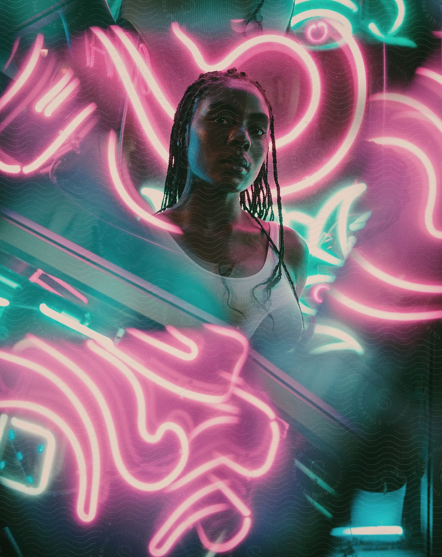 A woman with neon lights in the background