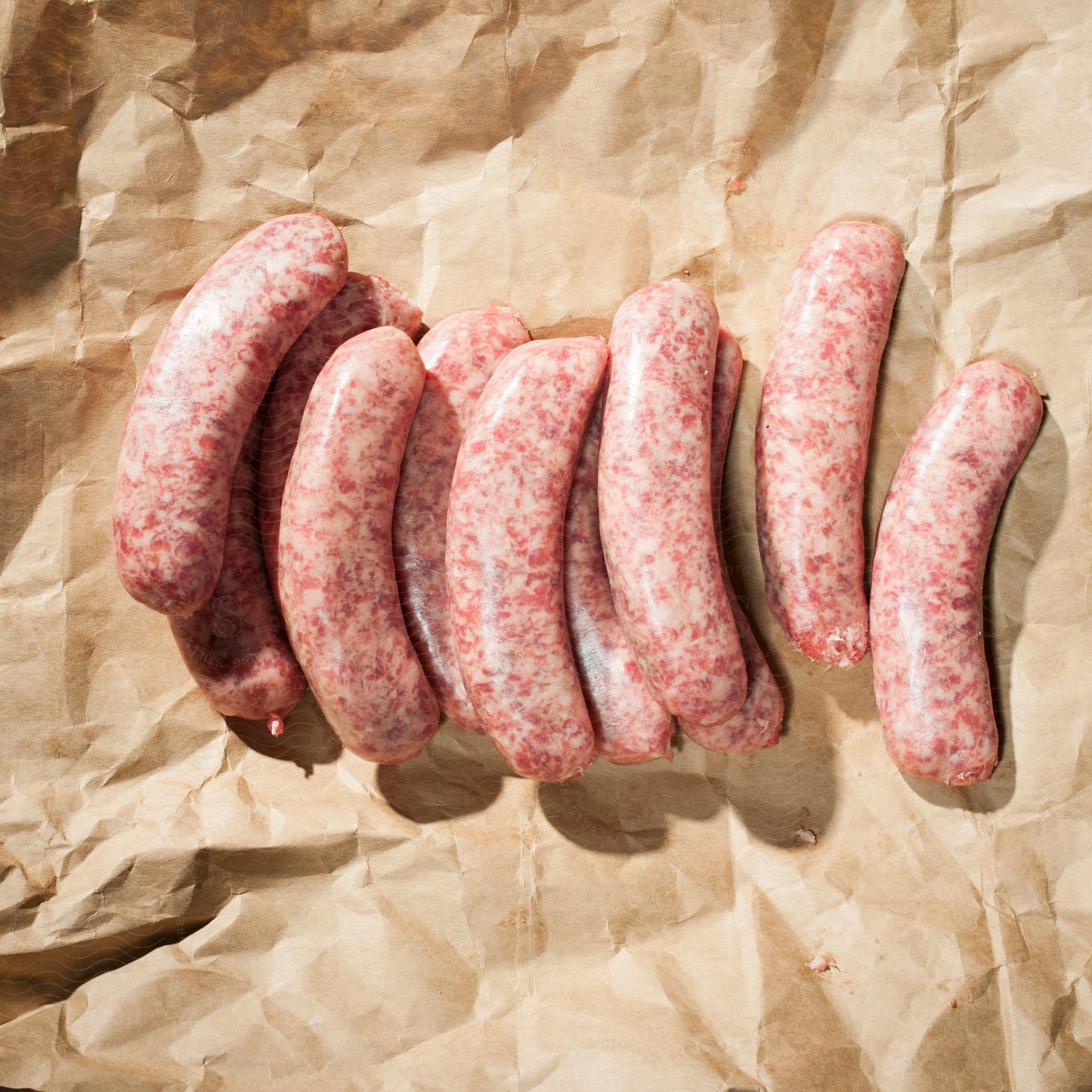 Stock photo of several sausages on a brown paper