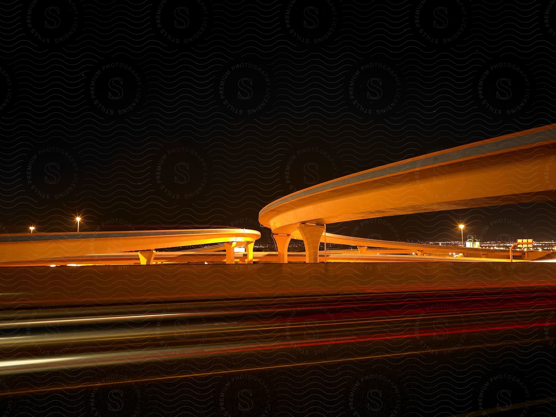 Long exposure shot of vehicles on a highway at night