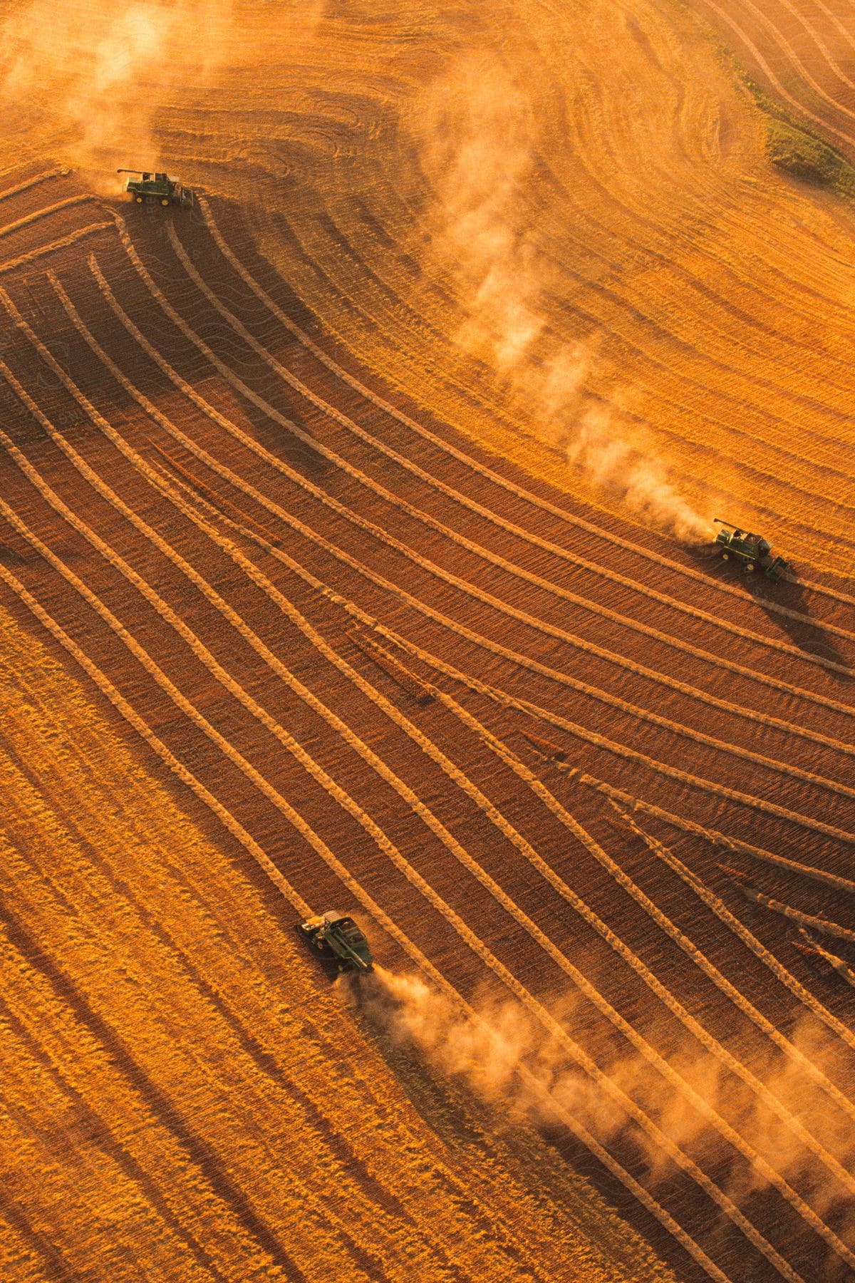 Aerial view of a countryside landscape with a truck and tractor in a farm setting