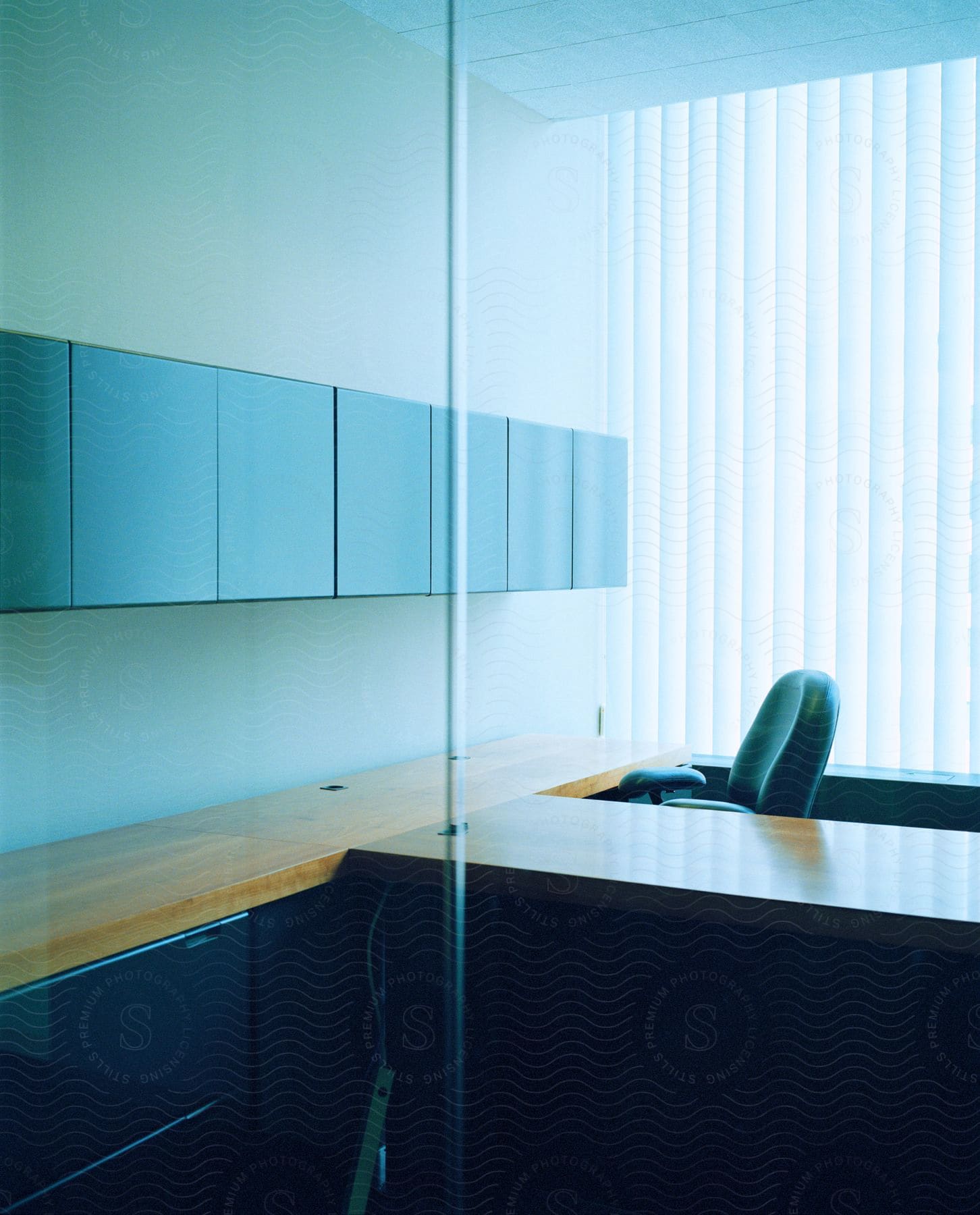 A chair behind a desk in an office