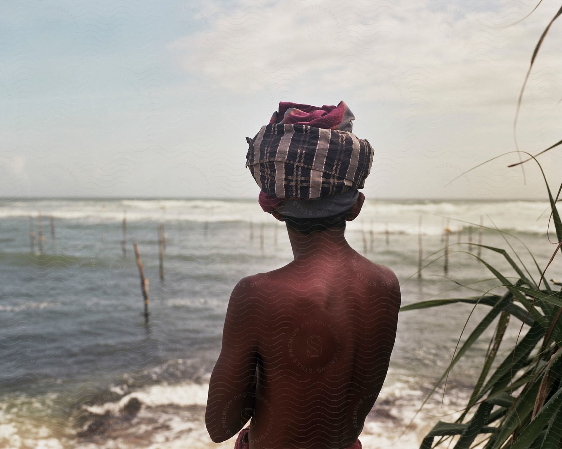 A boy observes the ocean