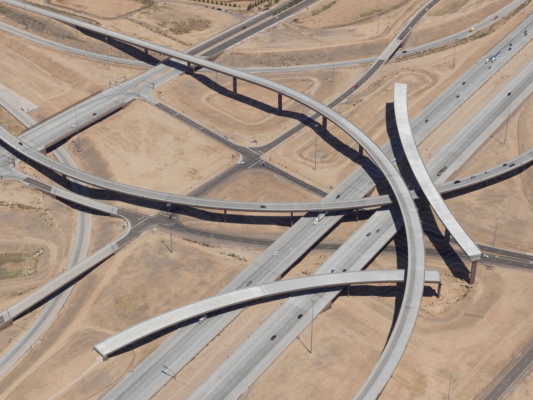 Aerial view of highway bridges and loops in a desert