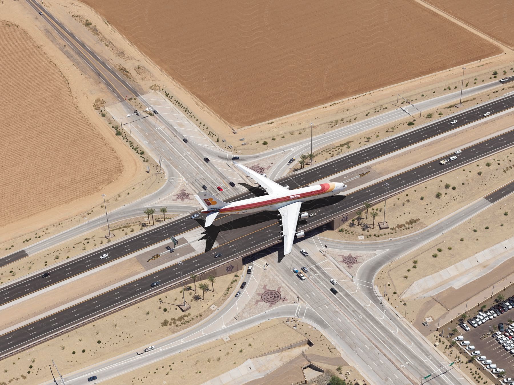 An iberia a340600 airplane is captured on a highway from an aerial perspective