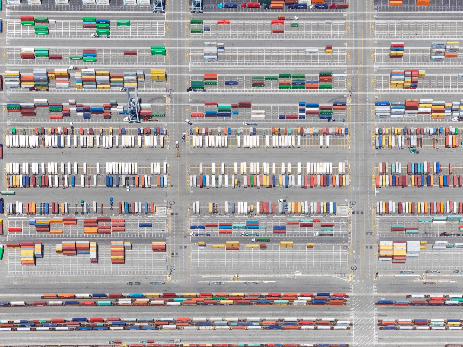 A shipping yard with organized containers in an outdoor lot