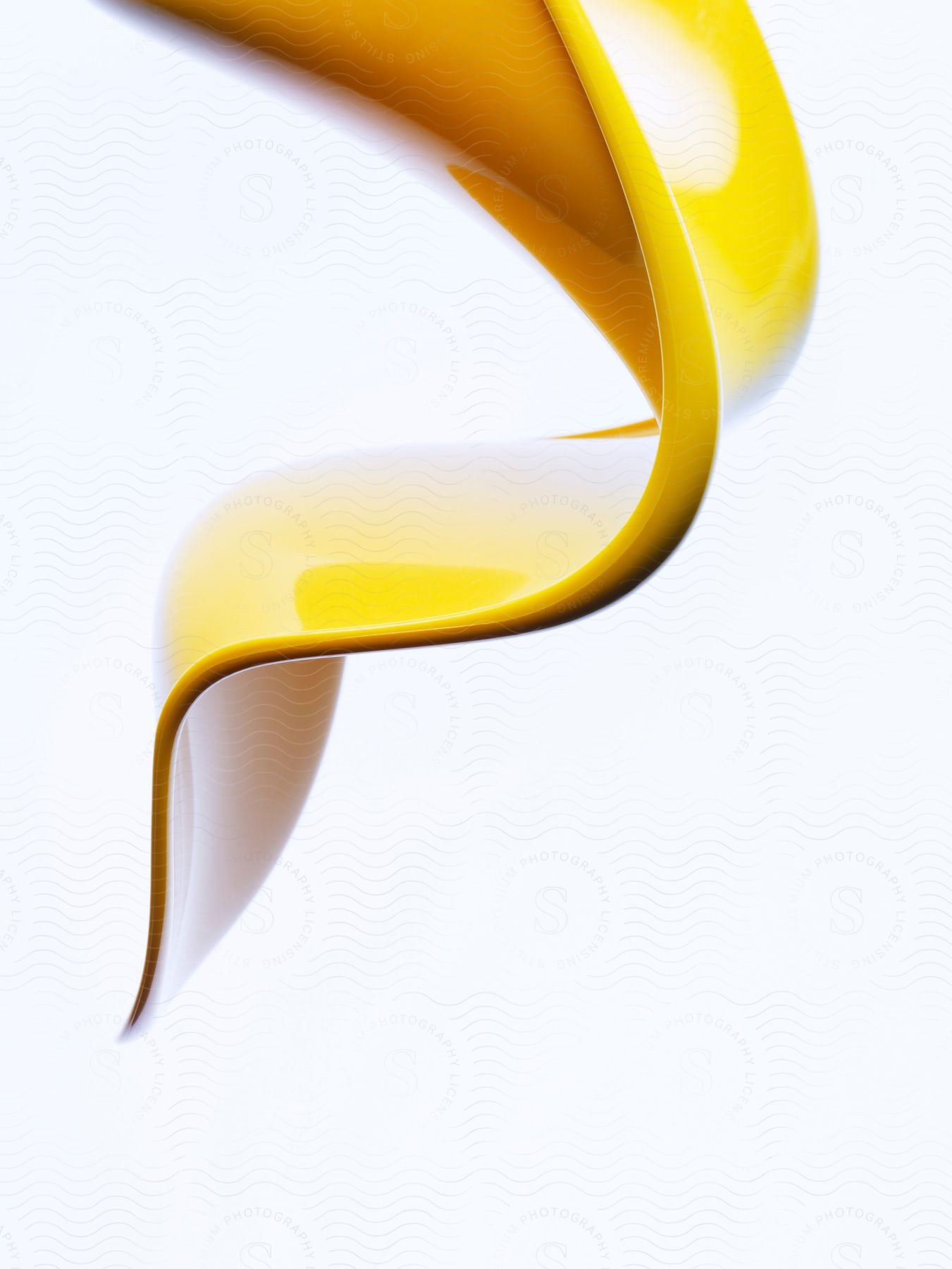 A yellow 3d paint against a white background