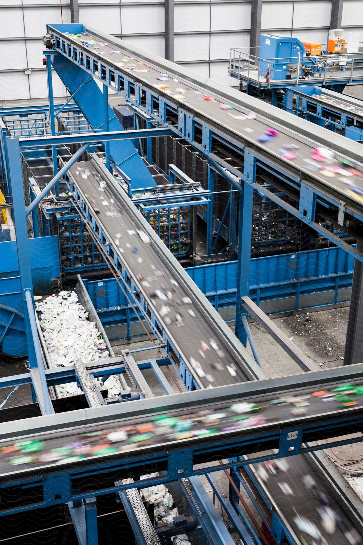 Interior of a factory with objects on conveyor belts