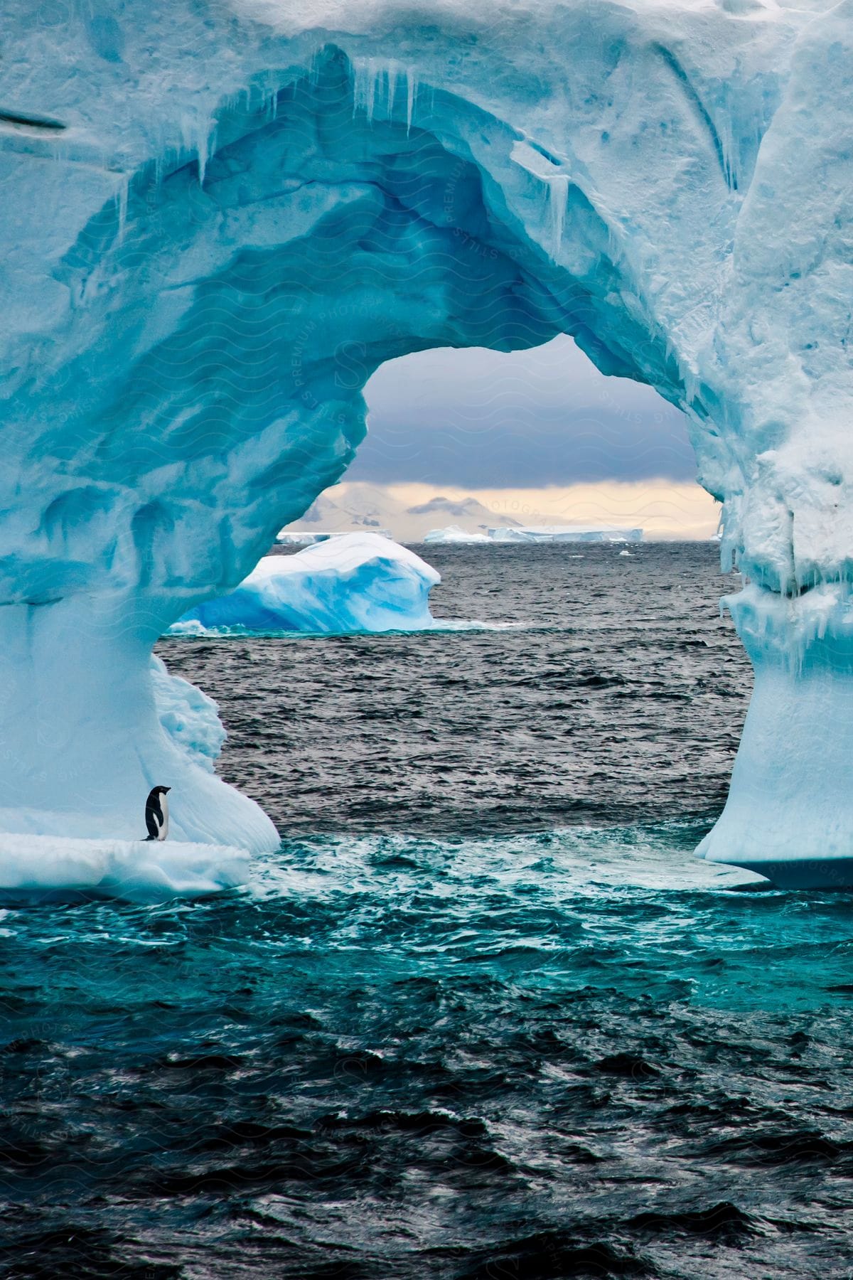 A giant arched iceberg off the coast of the atlantic ocean