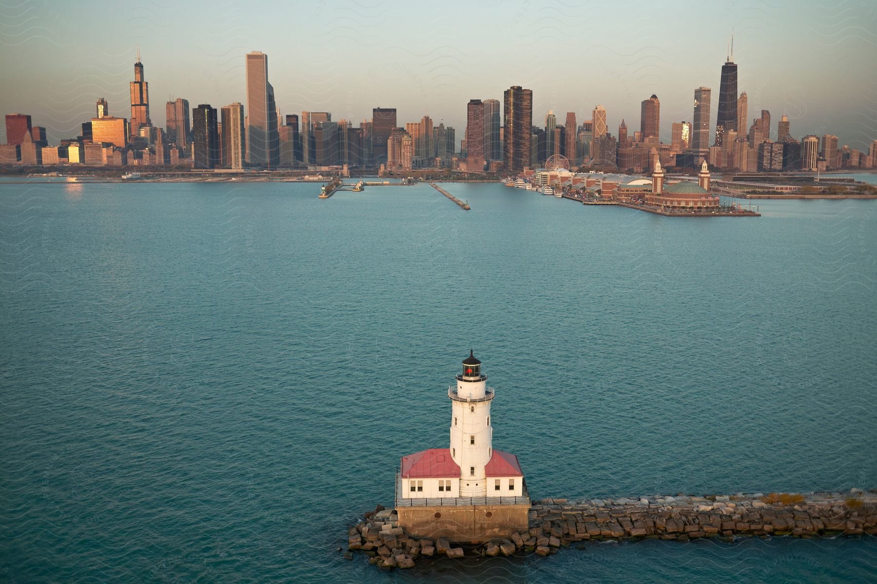 A city skyline is seen near ocean water