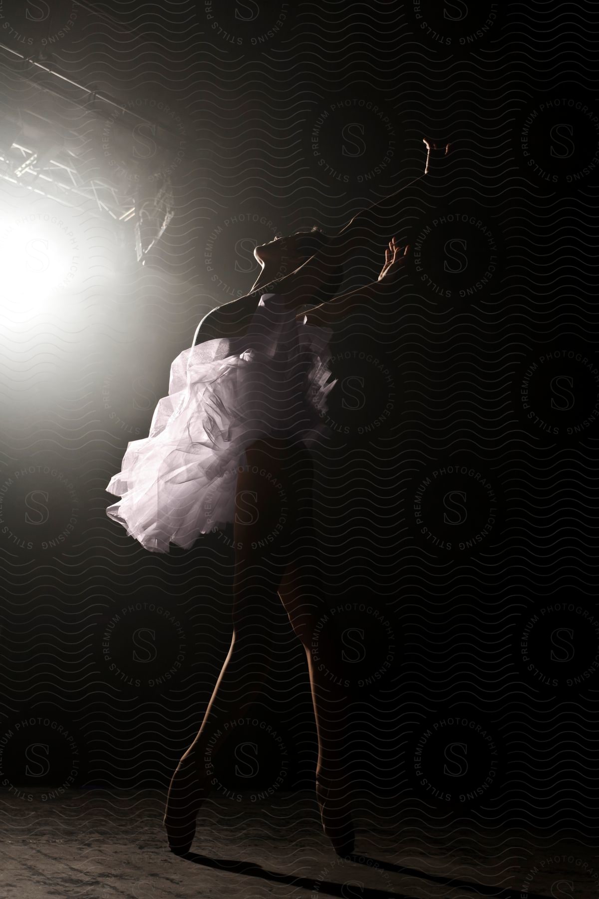A ballet dancer stands en pointe